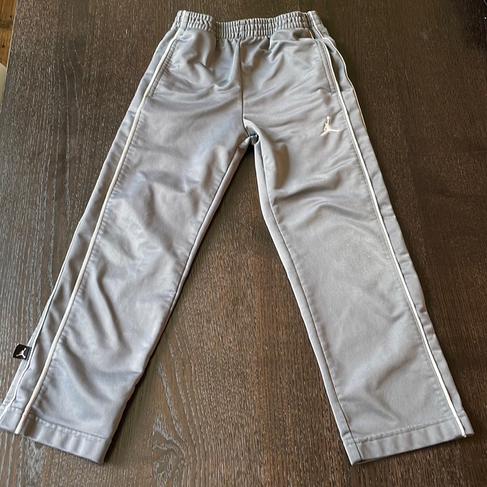 Size 5 kids Jordan jumpman track pants athletic pants in gray.
